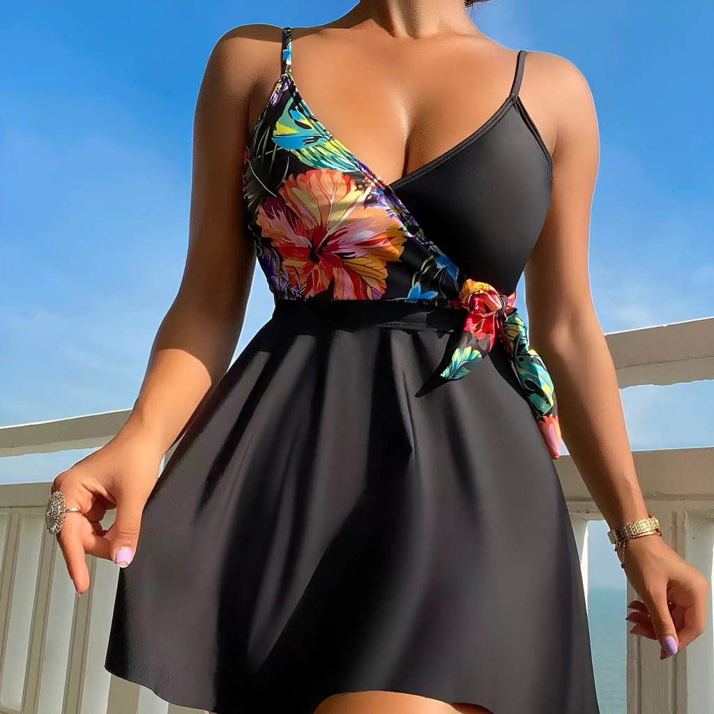 Black women's high waist briefs printed split bikini swimwear laid flat.