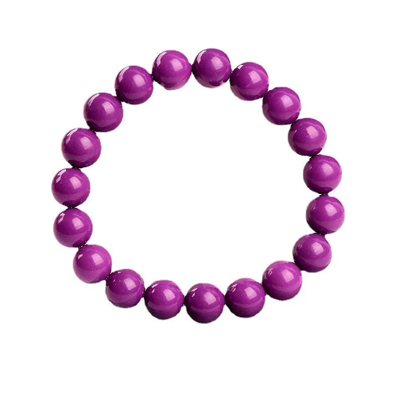 Purple Mica crystal bracelet with polished beads in a single circle design on a wrist.