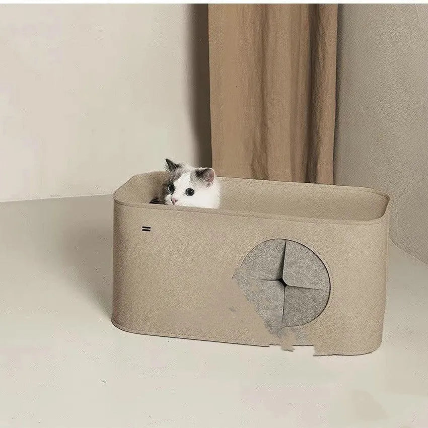 Foldable grey felt cat nest bed shown in a home setting next to a cat.