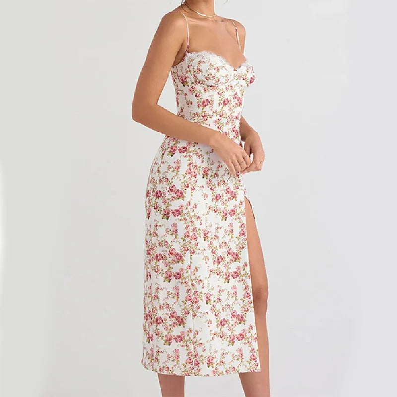 Women's long blue dress with lace flowers print, featuring suspender straps and a thigh-high slit.