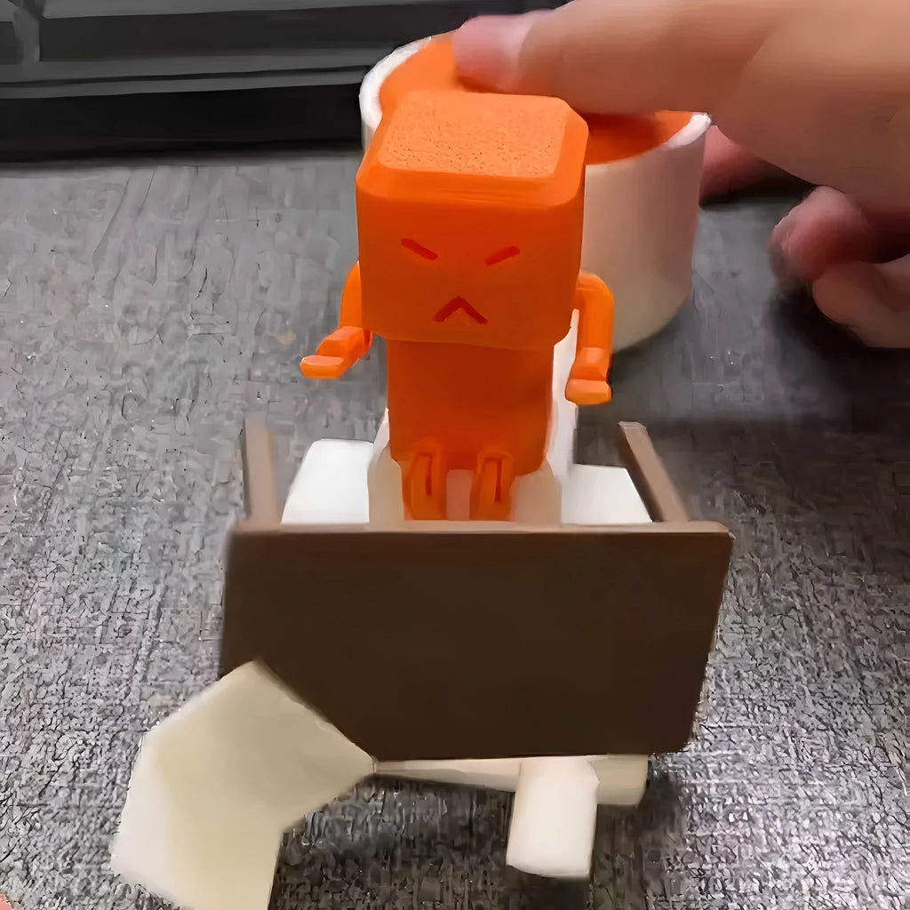 Orange plastic table-top decompression toy with turning parts