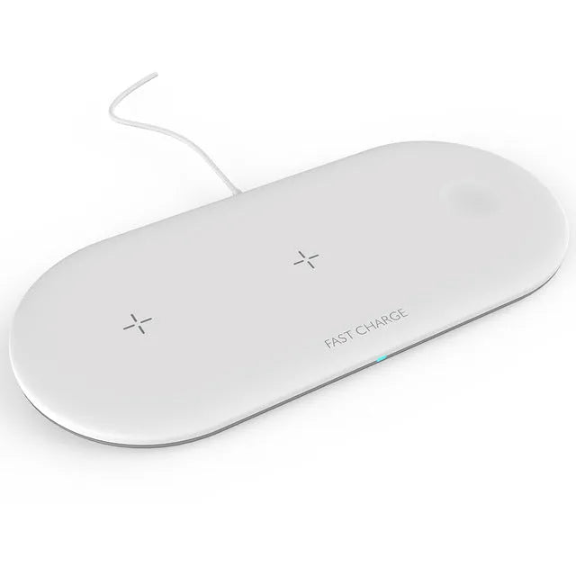 Black and white 3-in-1 wireless charging station for Apple-compatible phone, watch, and earbuds on a desk.