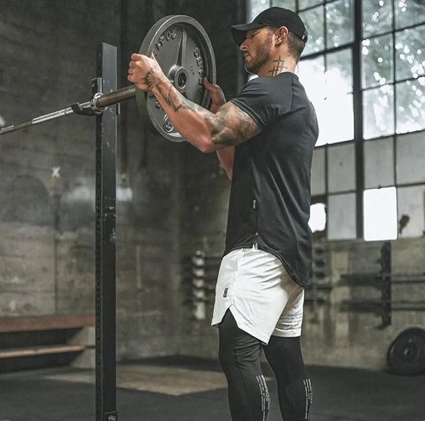 Plain men's gym shirt in cotton-spandex blend on a hanger, shown in army green colour.
