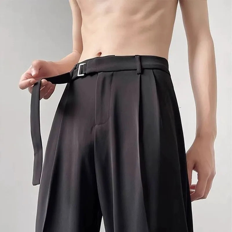 Women's black wide leg straight cut trousers with a non-iron finish on a neutral background