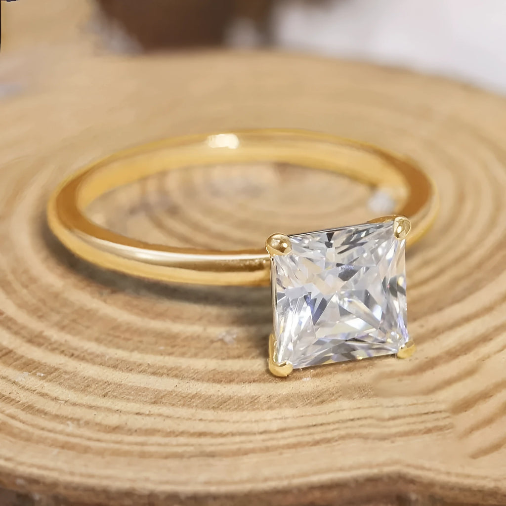 925 sterling silver geometric ring with round detail in silver, gold, and rose gold colours on a white background.