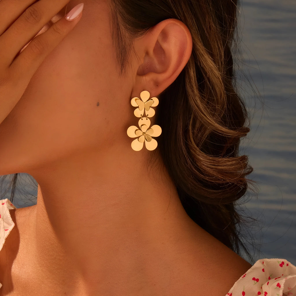 Women's stainless steel earrings with gold electroplated finish and floral butterfly design