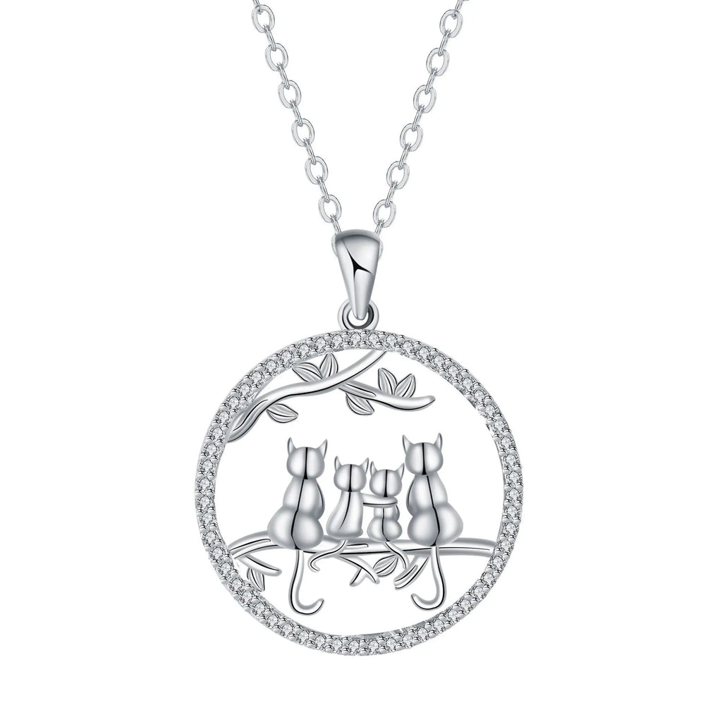 Copper necklace with electroplated four kitten pendant and cross chain.