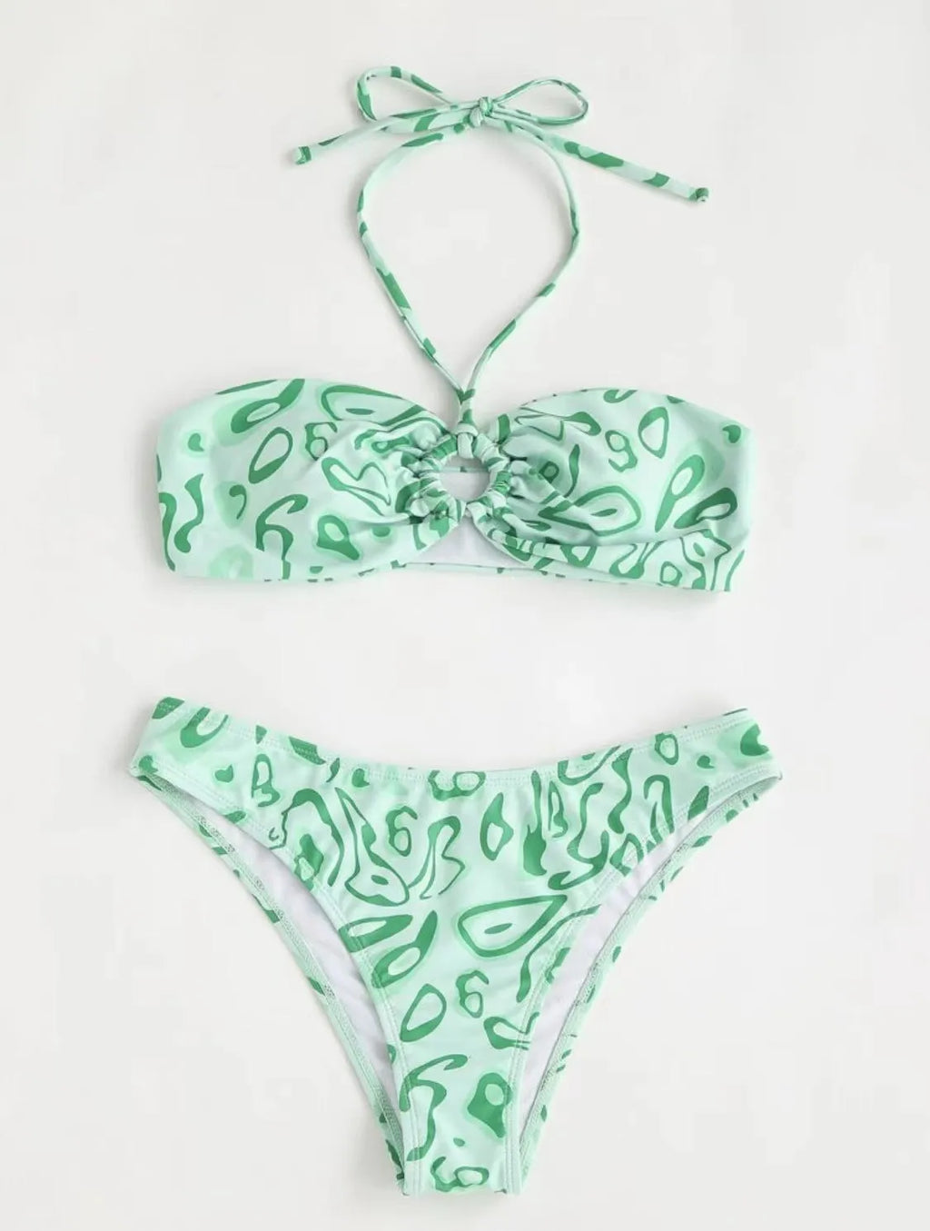 Green floral bandeau bikini with split design and backless styling on swimwear model