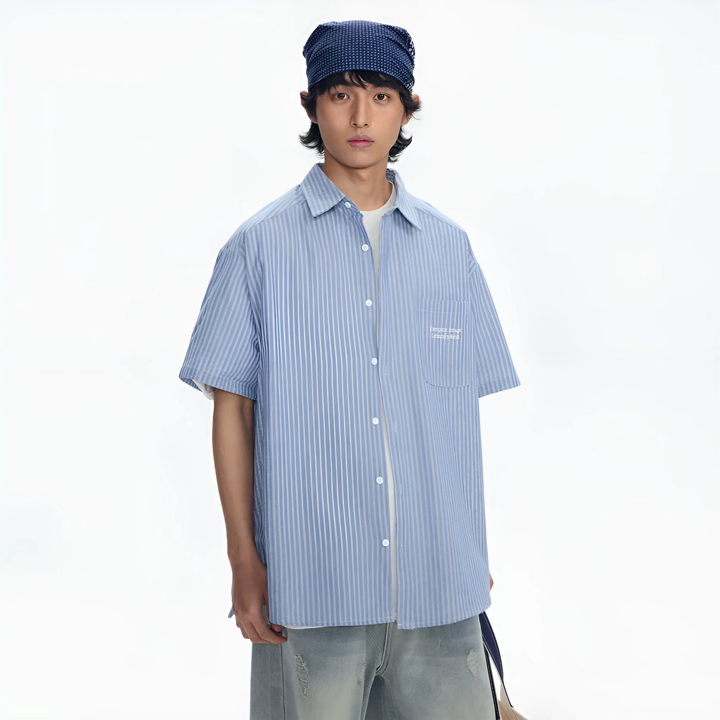 Blue and white striped loose-fitting short-sleeved shirt on a hanger