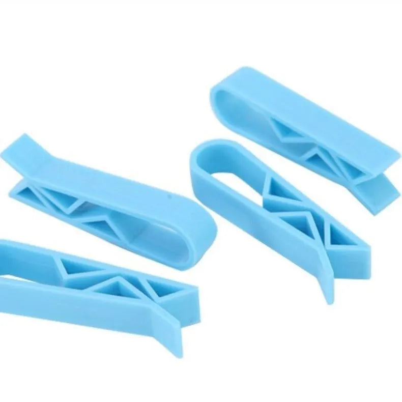 Grey PP plastic non-slip clip for fixing a bin bag to a waste bin rim.
