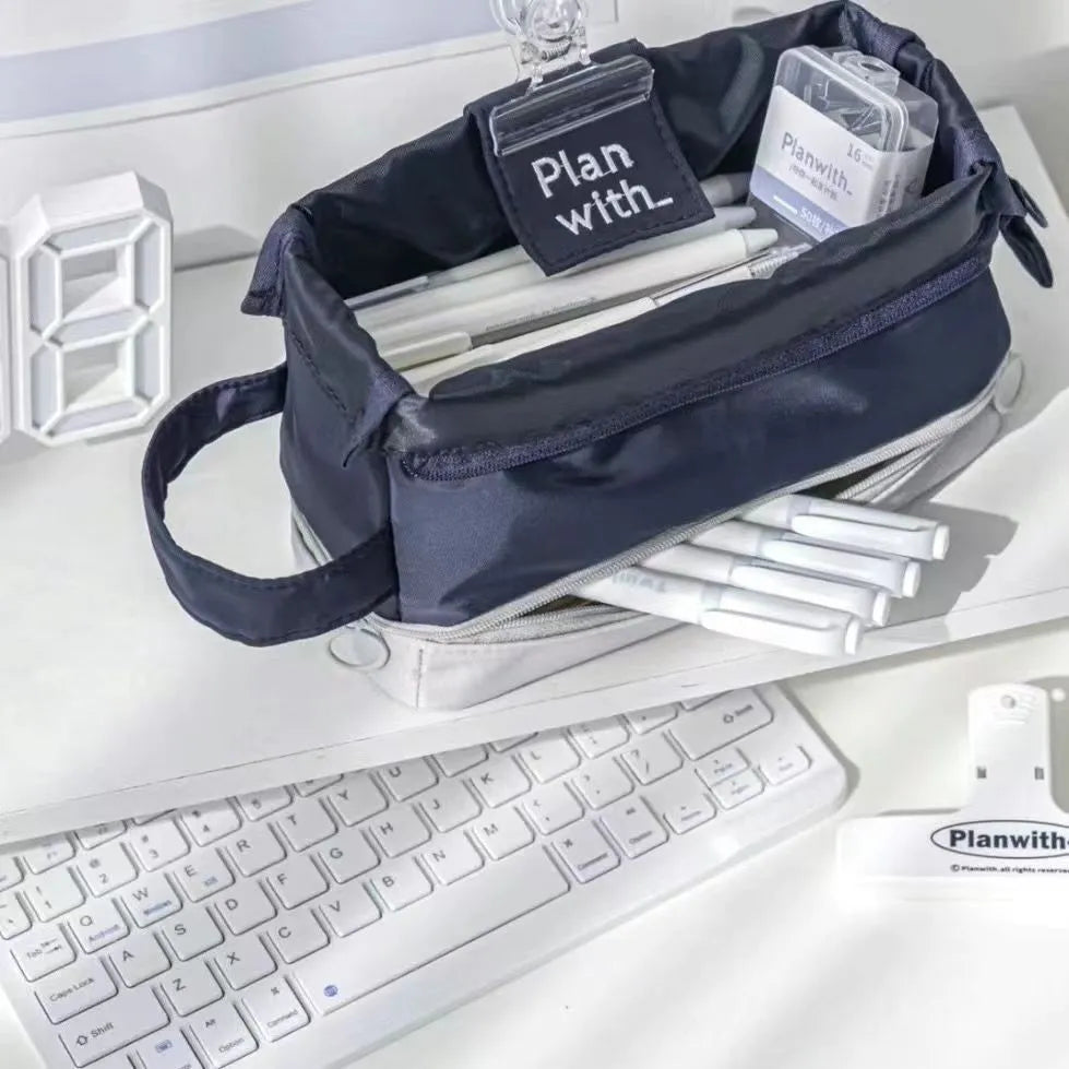 Dark blue folding double-layer polyester pencil case for students, also shown in blue and cream white.