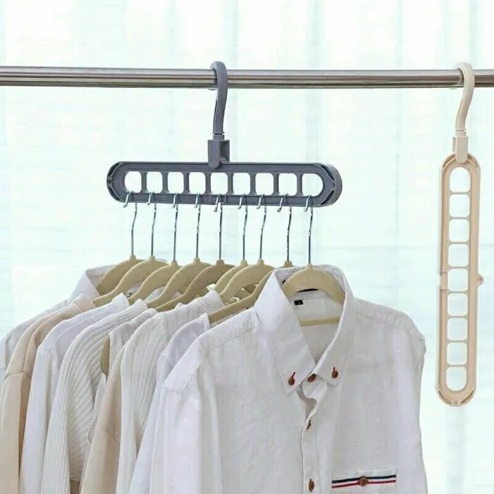 Pink or green heavy-duty plastic clothes hanger with rotating hook, shown holding a coat.