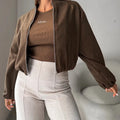 Women's off-shoulder coat with lantern sleeves in brown colour showing round neck design and pocket detail