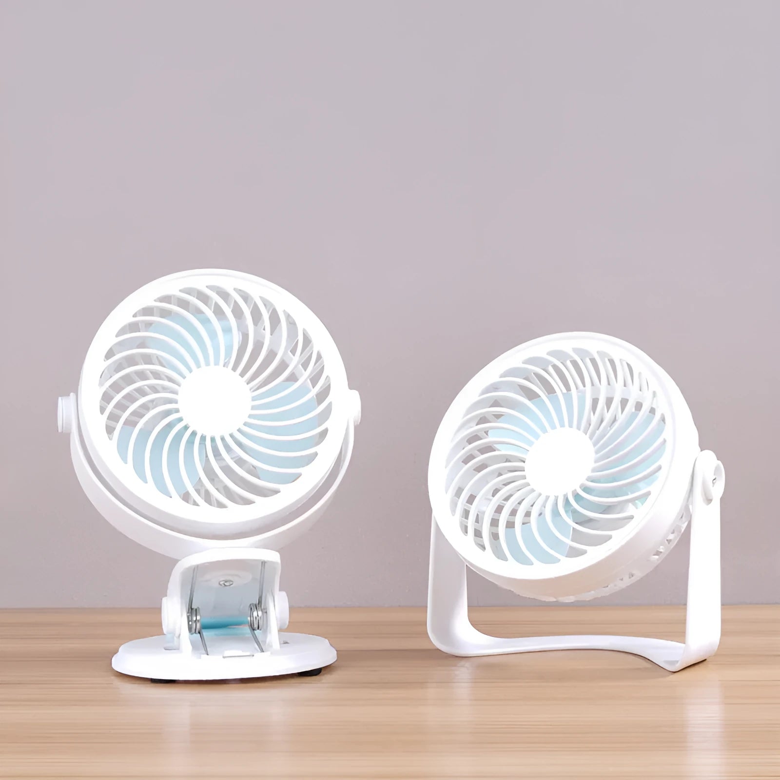 Mini USB desk fan in clip and floor standing styles on a wooden desk