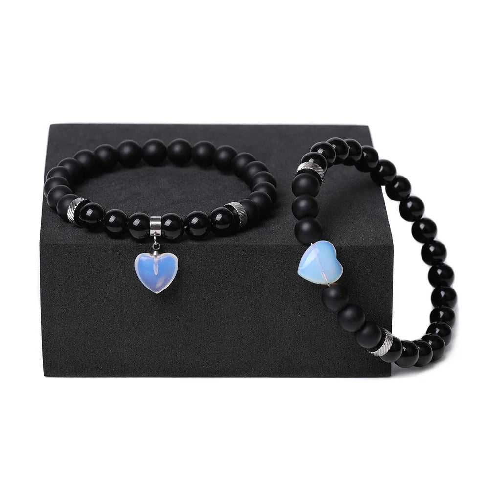 Polished natural stone couple heart bracelets in obsidian, agate, tigereye, crystal, aventurine, topaz, opal colours.