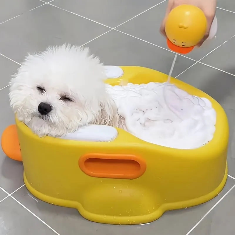 Duck-shaped blue PVC bathtub for washing dogs and cats on grass