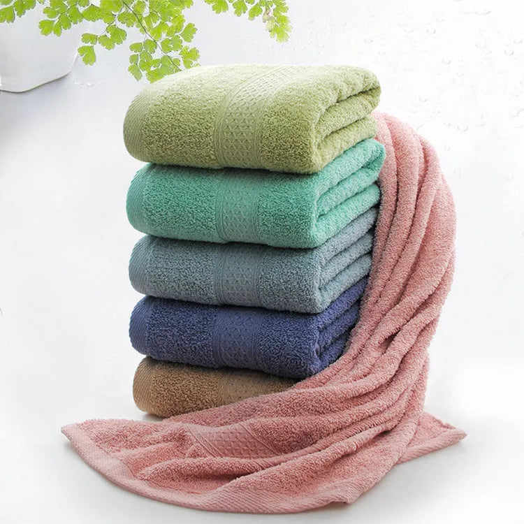 Thickened cotton blend bath towel shown in apple green colour on a bathroom rail.