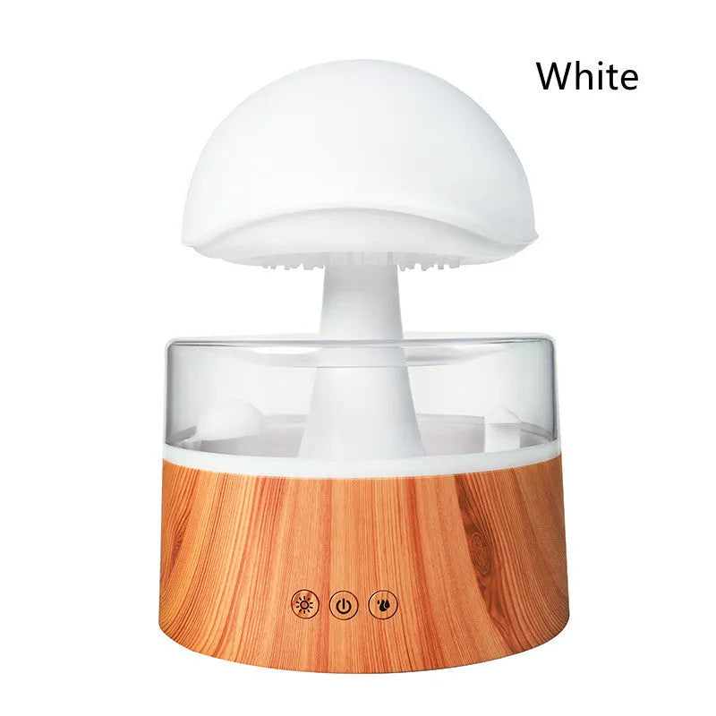 White cloud-shaped humidifier emitting mist with multi-coloured lighting and remote control