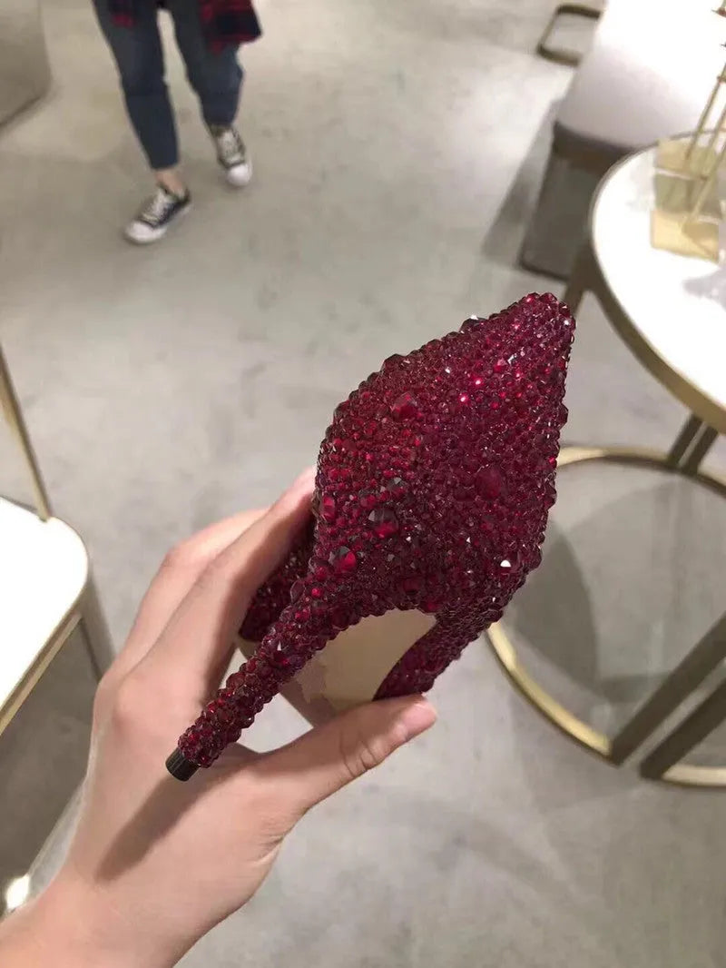 Women's gold high heels with pointed toe, stiletto heel and rhinestone sequin decoration