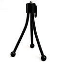 Small silver iron mini tripod with ball head, folded to compact size next to a smartphone.