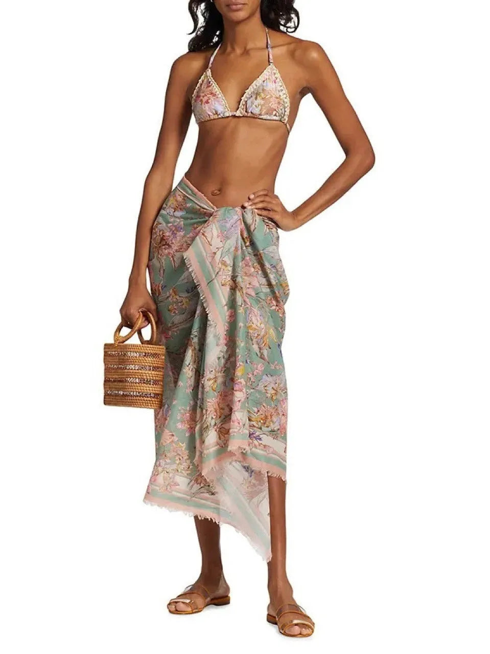 Women's creamy-white floral print bikini set with matching skirt for beach use
