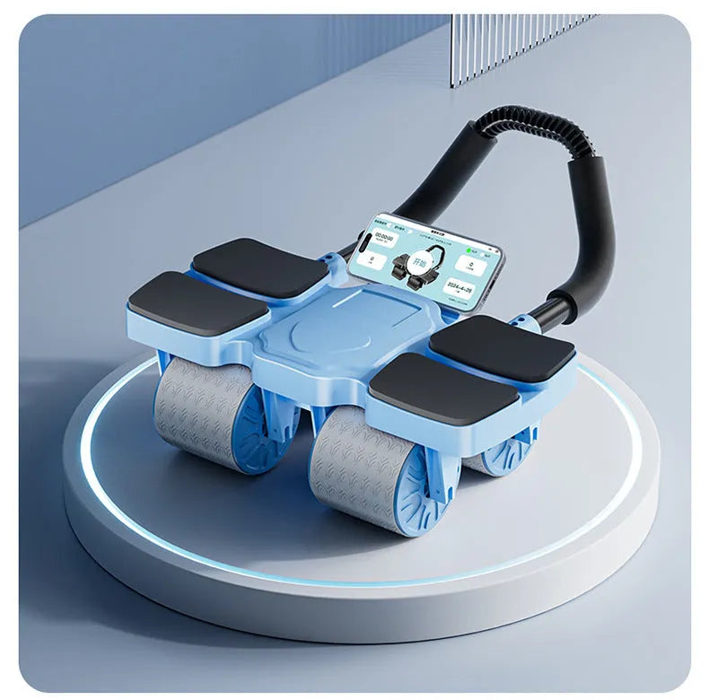 Black abdominal exercise wheel with four wheels and automatic rebound mechanism on a wooden floor.