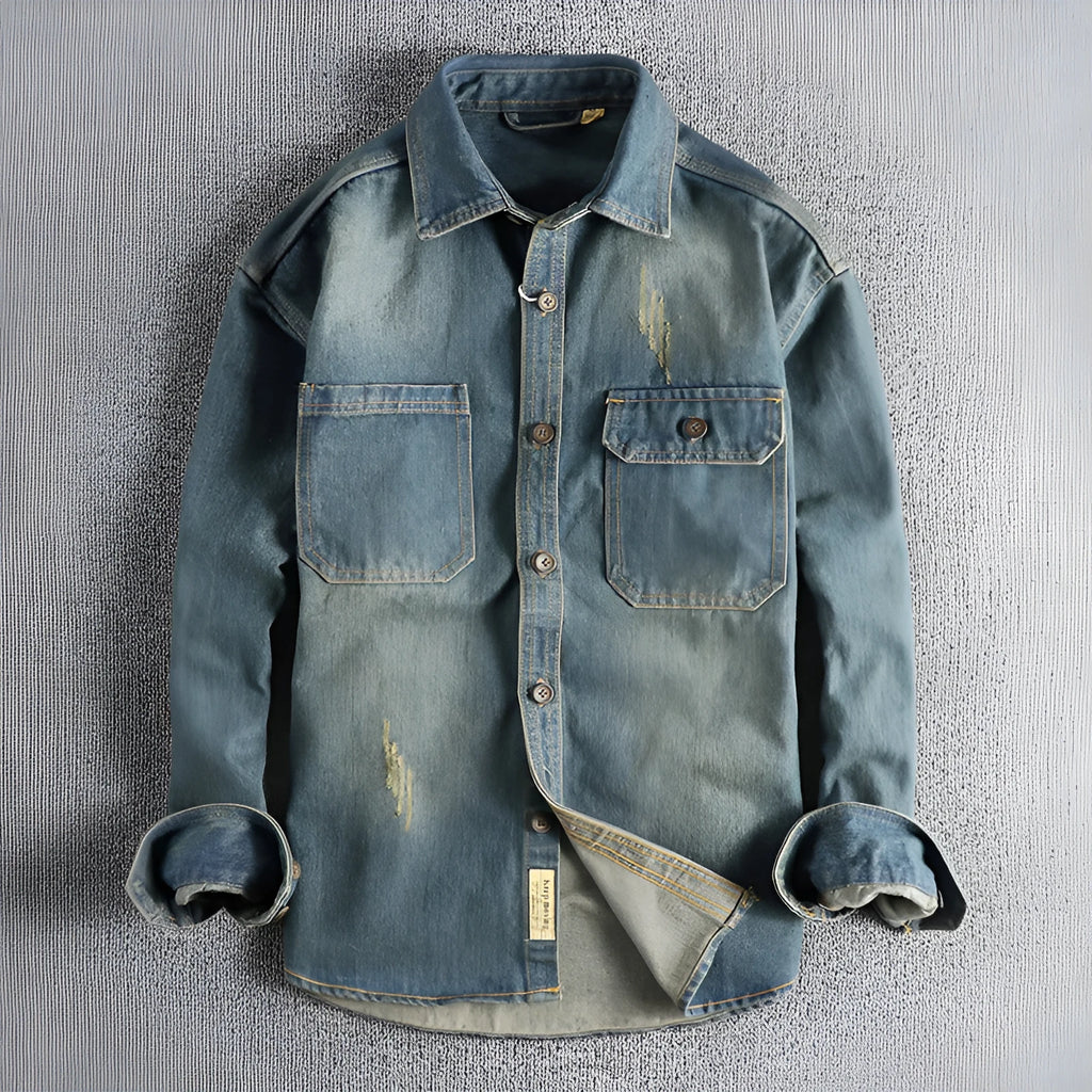 Men's light blue vintage wash denim shirt with loose fit and long sleeves on hanger