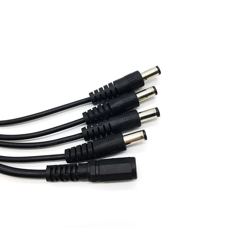 Black DC 4-way monitoring power cord with one input and four output connectors for CCTV cameras