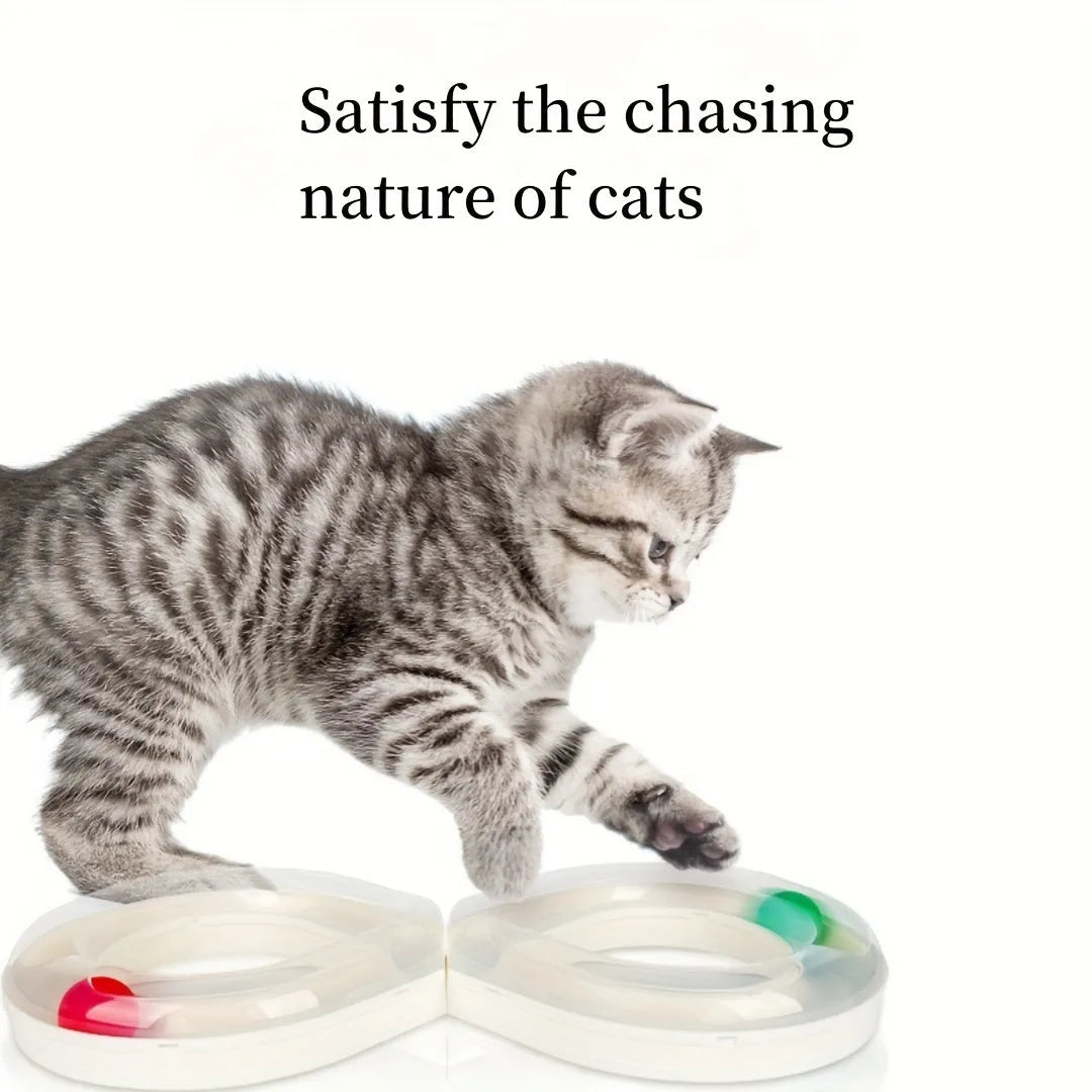 Blue and white cat turntable track ball toy with teasing stick attachment on flat surface