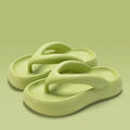 Solid colour thick-soled EVA flip-flops with a bow detail on the strap.
