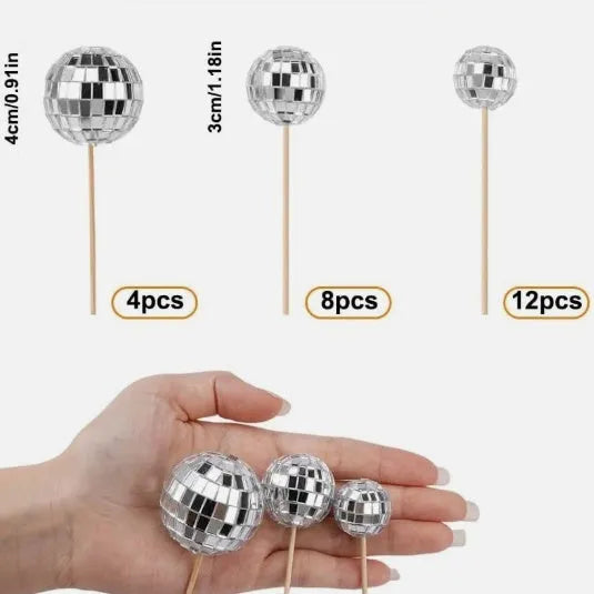 Glass disco ball cake decoration with wooden stick, shown in various sizes from 2.5cm to 5cm.