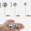 Glass disco ball cake decoration with wooden stick, shown in various sizes from 2.5cm to 5cm.