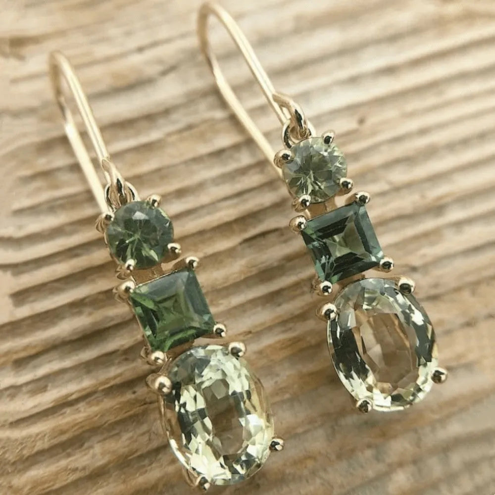 A pair of green geometric copper earrings with a quadrilateral shape in a retro bohemian style.
