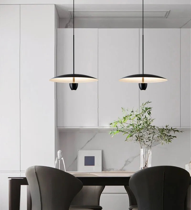 Black modern minimalist chandelier with clean lines and warm lighting