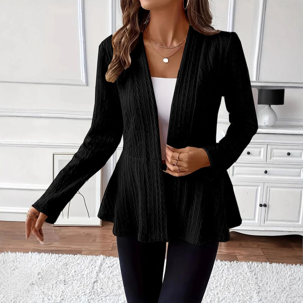 Women's apricot knitted cardigan with one button and jacquard pattern on a hanger.