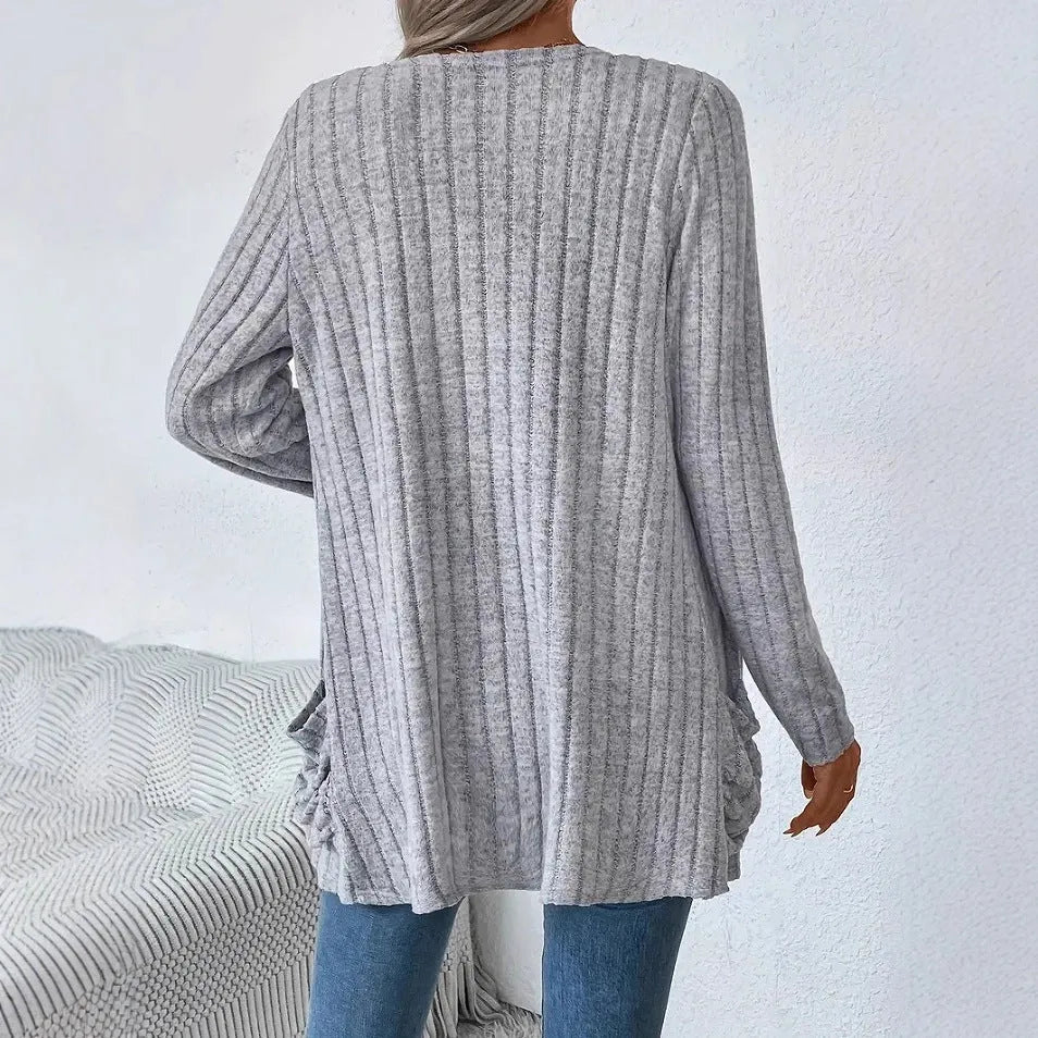 Men's loose fit grey long sleeve cardigan with a pocket, shown on a hanger.