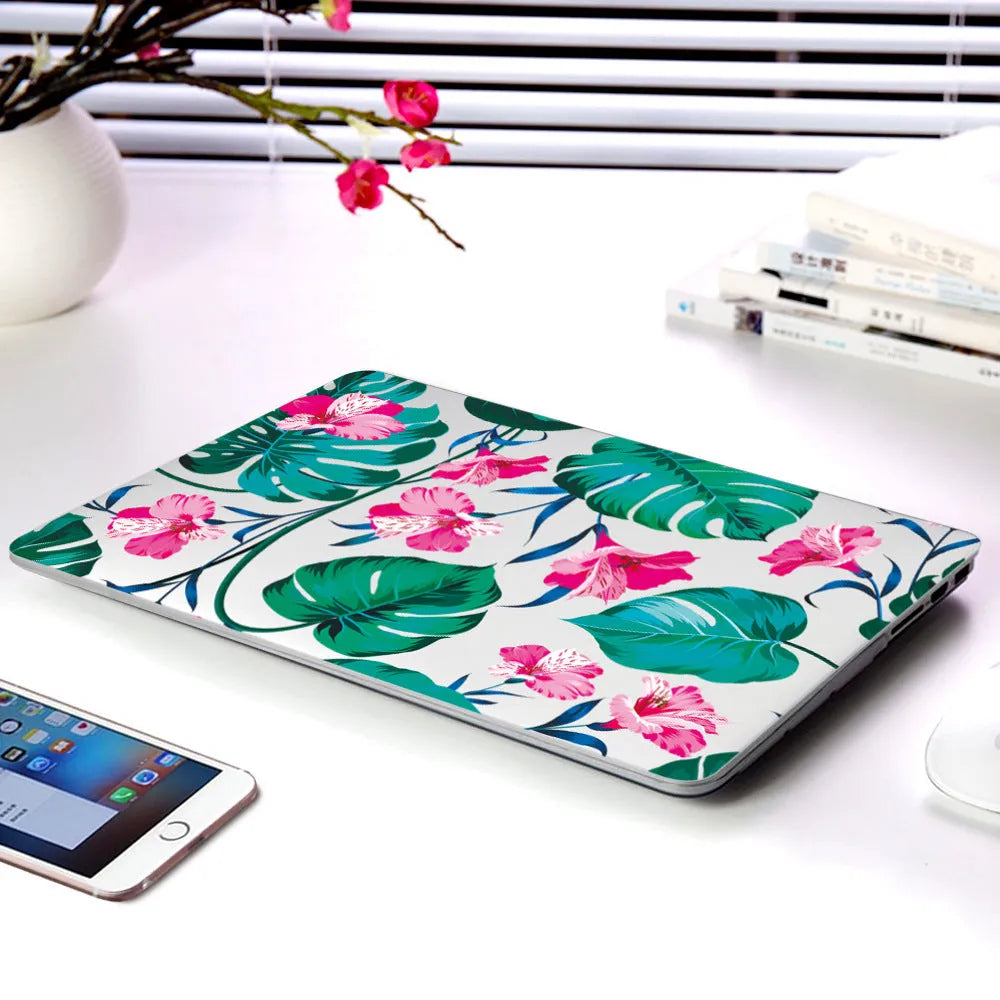 Hard plastic laptop protective shell with a partial floral print design for MacBook Air and Pro models.