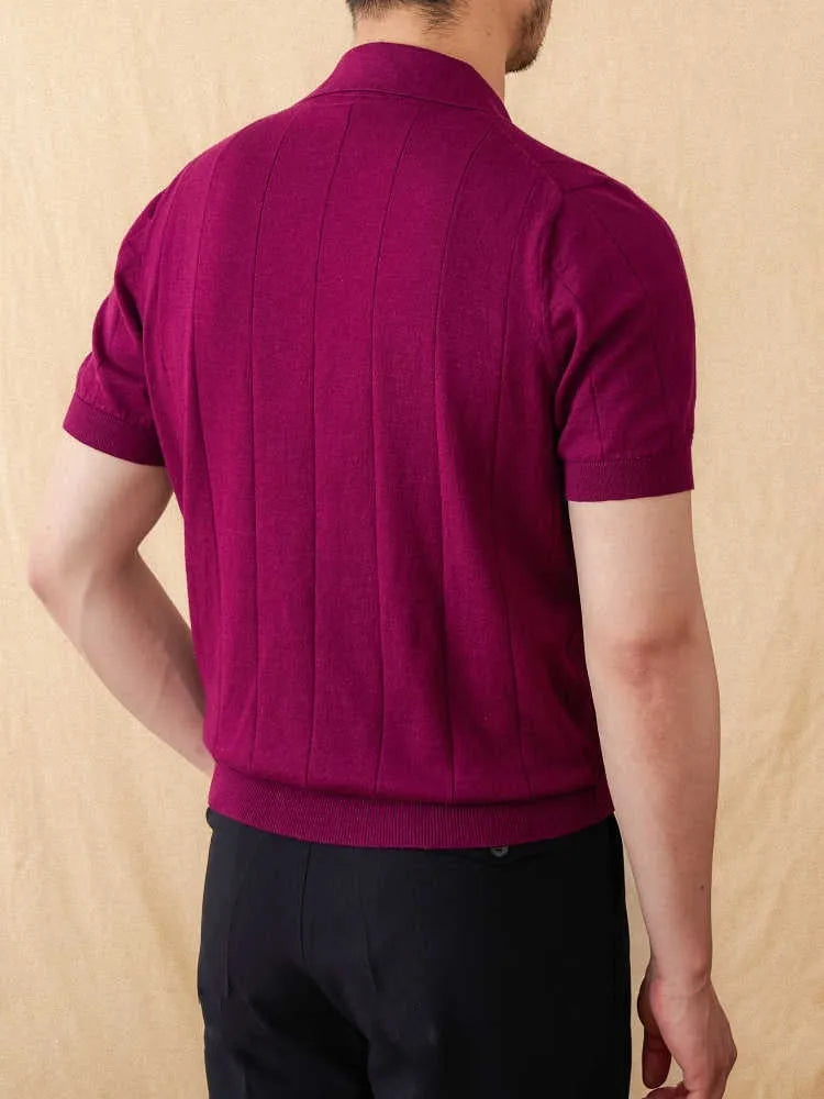 A purple short sleeve polo shirt with a seagull collar and a thin, sunken stripe knitted texture.