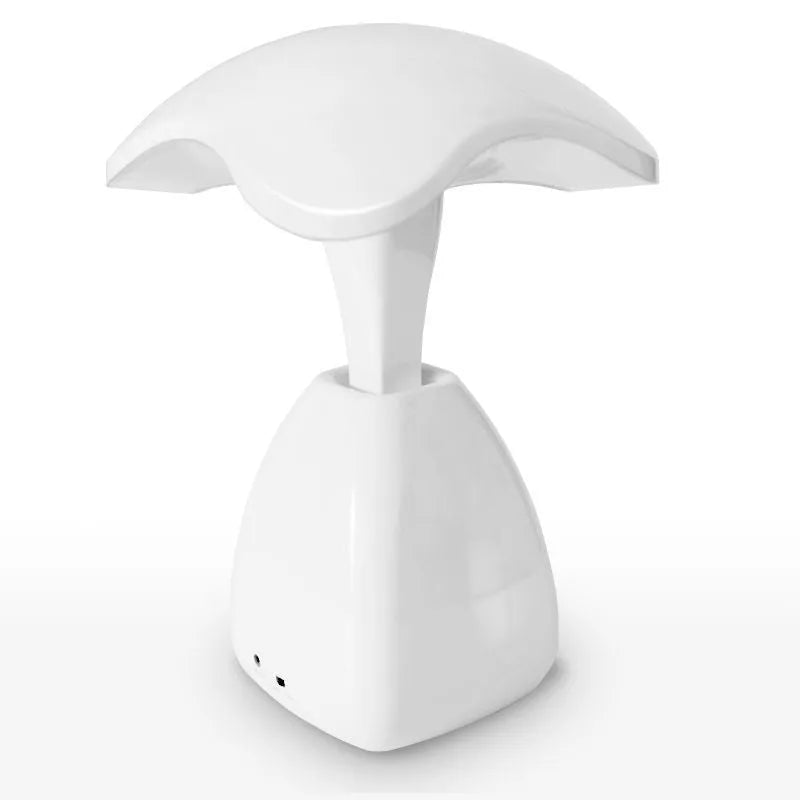 White plastic LED desk lamp with touch controls and built-in battery for bedside use