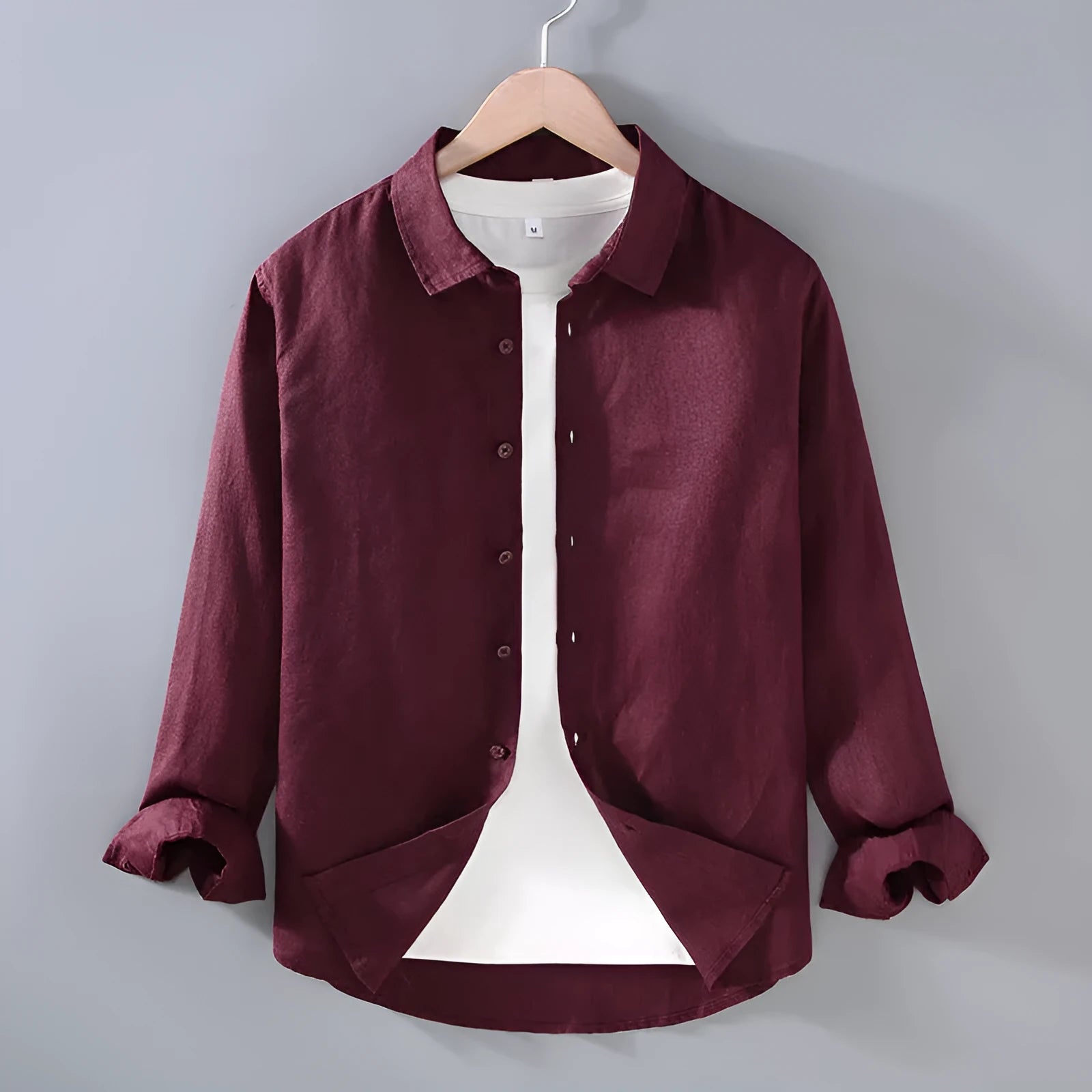 Men's pure linen cardigan-style shirt in solid colours showing long sleeves and simple design