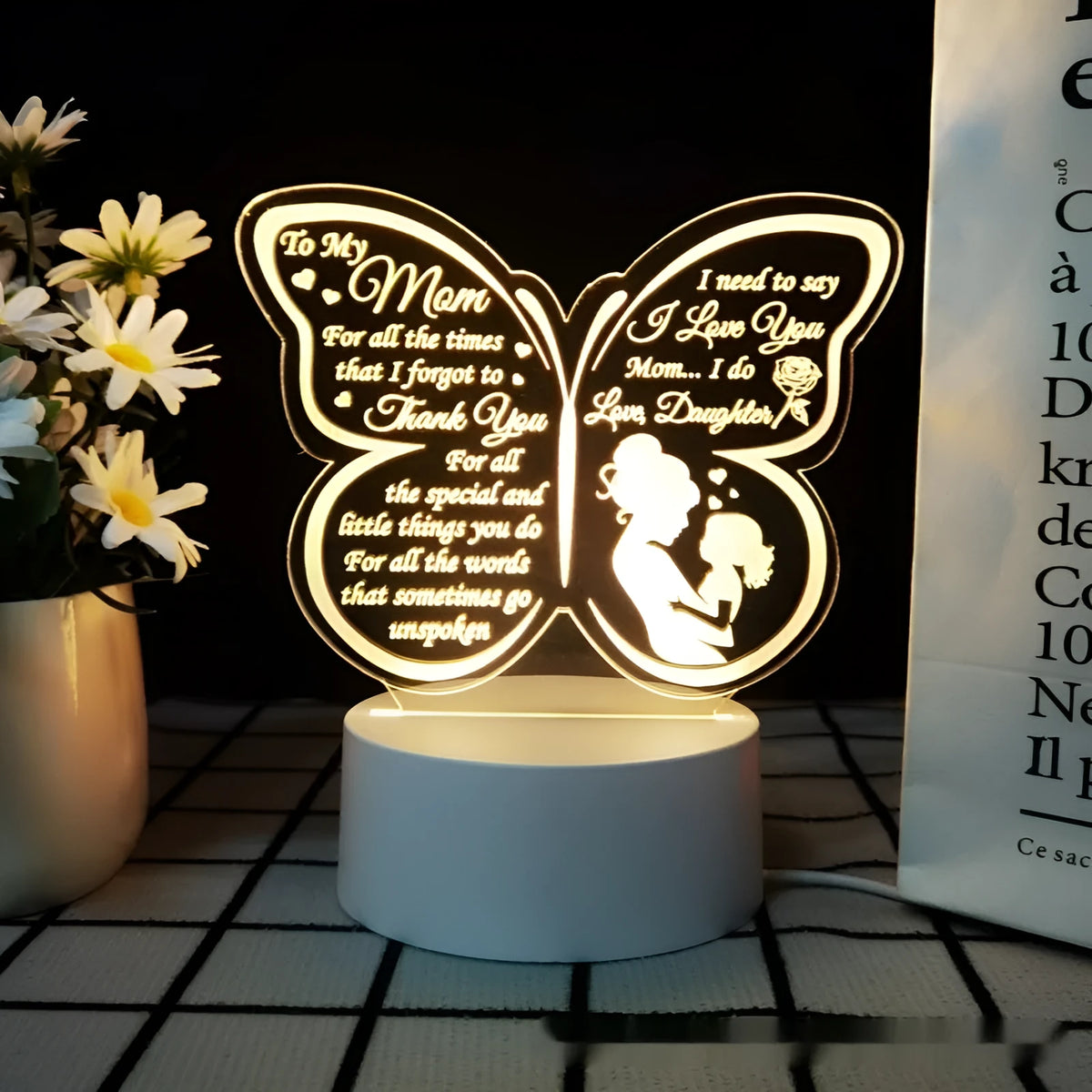 White heart-shaped acrylic table lamp with touch switch on a wooden surface