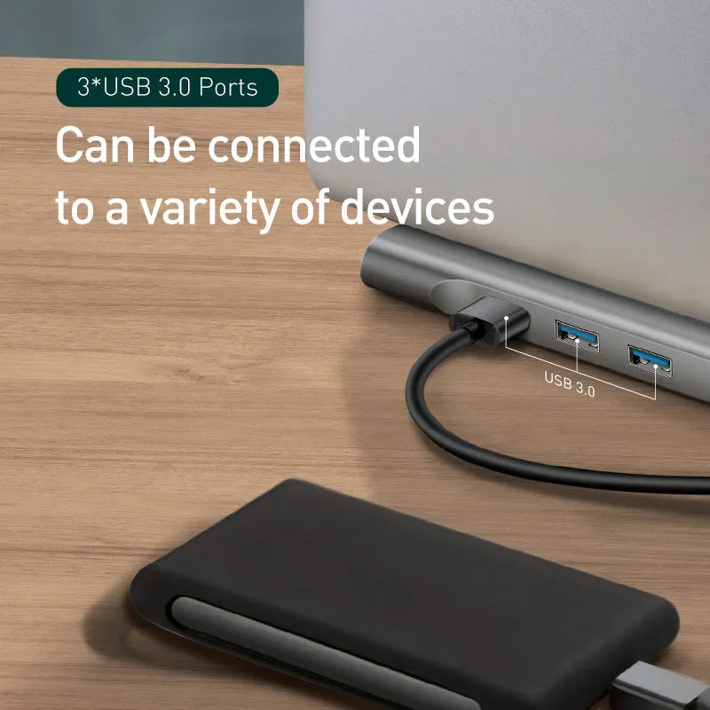 Grey aluminium ten-port docking station with cooling bracket showing HDMI, VGA, and Ethernet ports