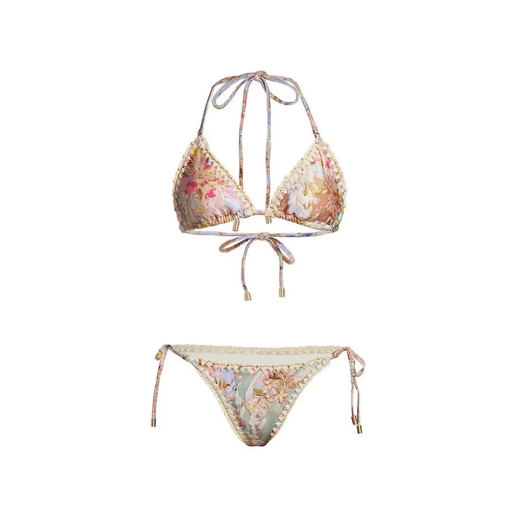 Women's creamy-white floral print bikini set with matching skirt for beach use