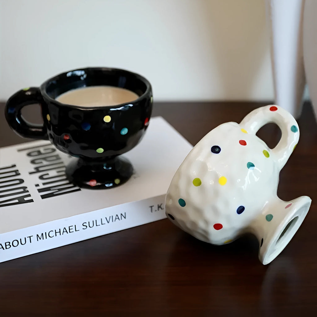 Irregular shaped hand-pinched ceramic mug in solid colour showing unique contours and modern design