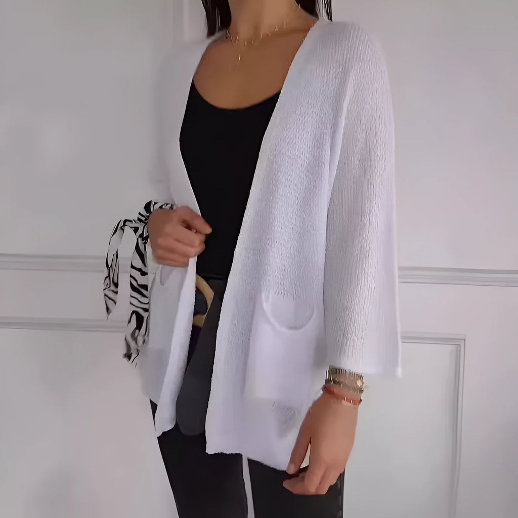 Women's army green waffle knit cardigan coat with nine-quarter sleeves and pockets.