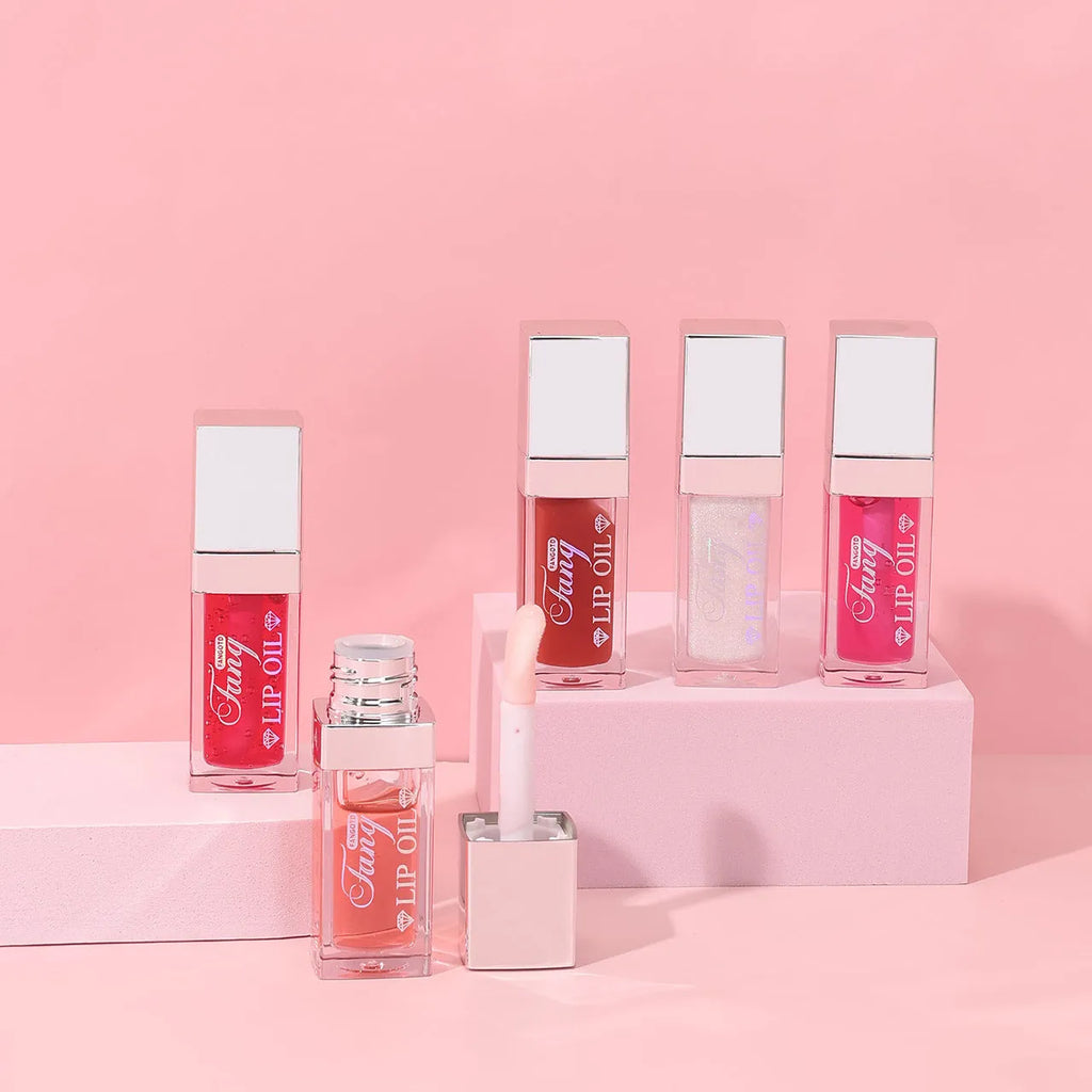 Mint lip gloss and lipstick set showing five bright colour options with lip essence oil