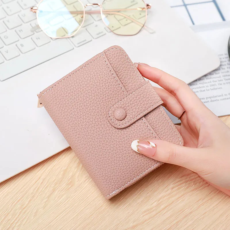 Women's short organ wallet with lychee pattern lining in beige, pink, black and red colours