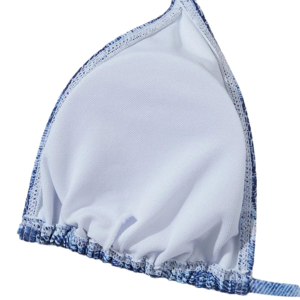 Denim blue women's bikini set with printed design and strap detail, sizes S to XL.