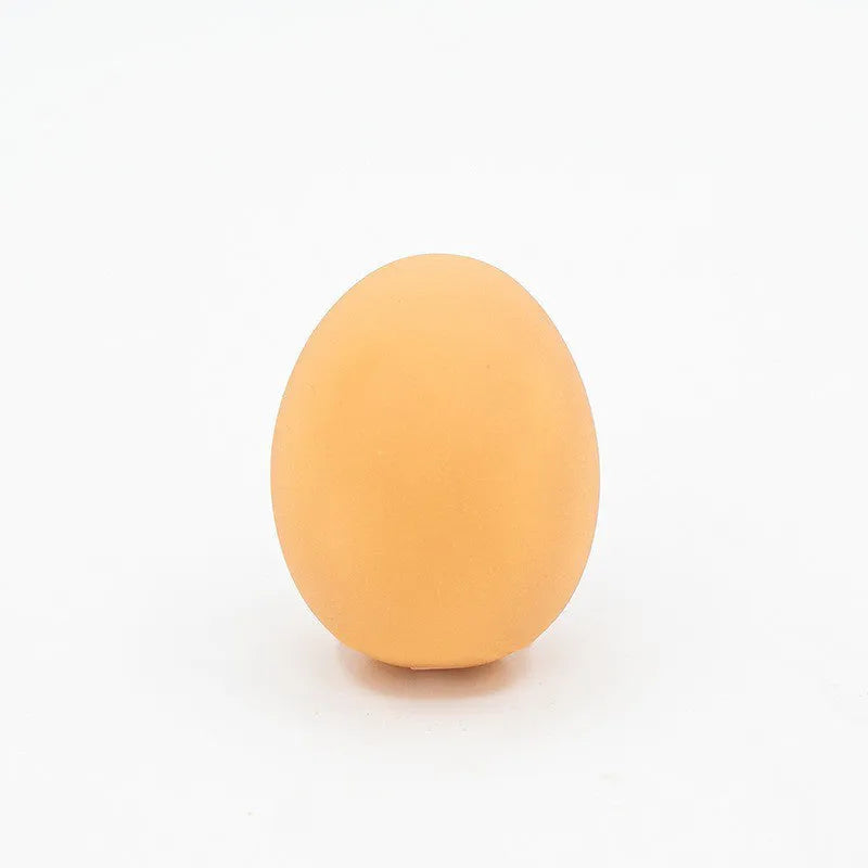 White simulation egg shaped dog toy with textured surface for teeth cleaning