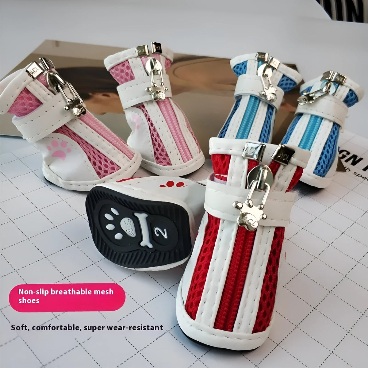 Four blue cloth dog shoes for small dogs with zipper closures on a white background.